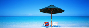 Chairs under an Umbrella on the Beach, Turks and Caicos Islands, North Atlantic Ocean