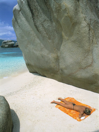 Woman Sunbathing on Beach Beween Rocks, Coco Island, Praslin, Seychelles, Indian Ocean, Africa